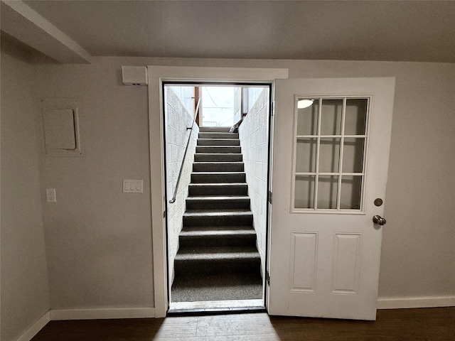 506 1st Ave E Unit A, B, C, Eureka, MT 59917 - doorway to outside featuring baseboards, stairs, and wood finished floors