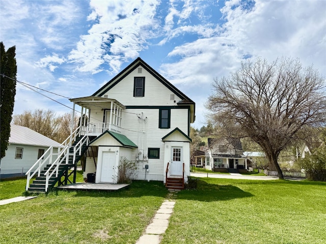 506 1st Ave E Unit A, B, C, Eureka, MT 59917 - back of house with stairway and a yard