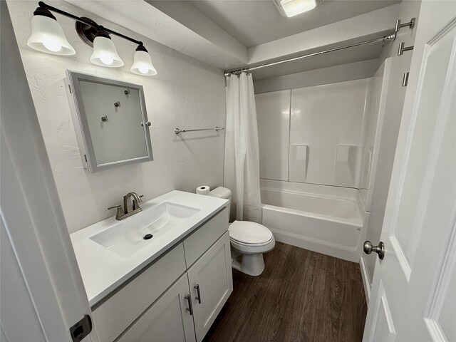 506 1st Ave E Unit A, B, C, Eureka, MT 59917 - full bathroom featuring vanity, wood finished floors, toilet, and shower / tub combo
