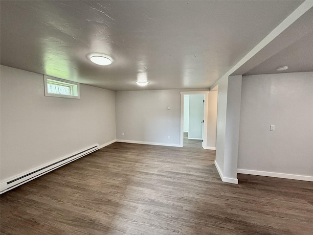 506 1st Ave E Unit A, B, C, Eureka, MT 59917 - below grade area with dark wood finished floors, baseboards, and baseboard heating