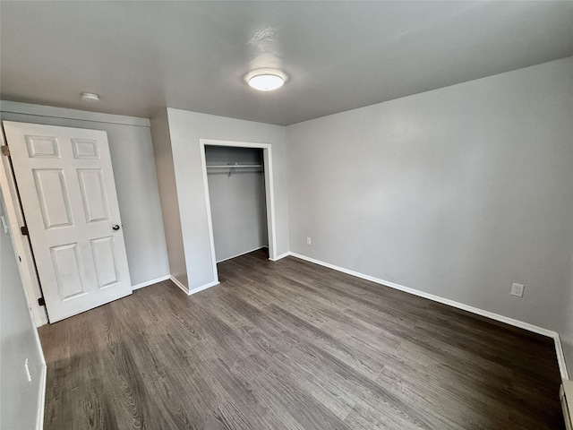 506 1st Ave E Unit A, B, C, Eureka, MT 59917 - unfurnished bedroom featuring dark wood-style flooring, baseboards, and a closet