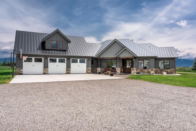 45331 Turnquist Rd, Ronan, MT 59864 - modern inspired farmhouse featuring driveway, stone siding, and metal roof