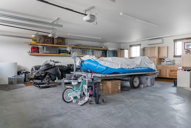 45331 Turnquist Rd, Ronan, MT 59864 - garage featuring a wall unit AC and a garage door opener
