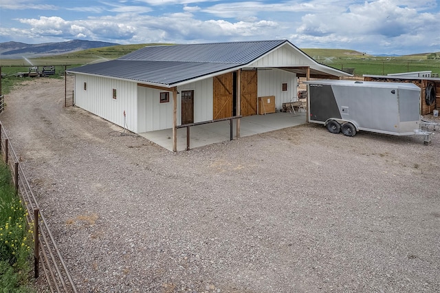 45331 Turnquist Rd, Ronan, MT 59864 - view of home's exterior with metal roof, a rural view, and a mountain view
