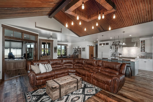 45331 Turnquist Rd, Ronan, MT 59864 - living area with dark wood finished floors, wood ceiling with exposed beams, and high vaulted ceiling