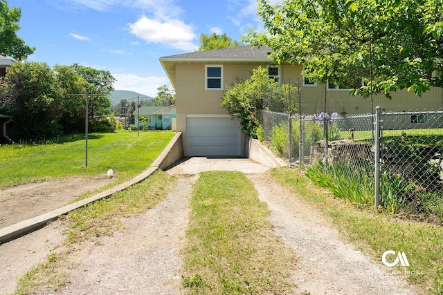 1302 Highland St, Helena, MT 59601 - back of property featuring dirt driveway and a garage