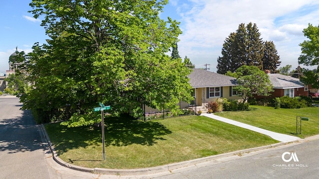 1302 Highland St, Helena, MT 59601 - view of front facade with a front yard and a shingled roof