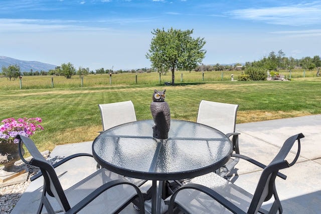 1618 Creekside Dr, Stevensville, MT 59870 - view of patio / terrace featuring outdoor dining area, a view of countryside, and a mountain view