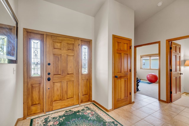 1618 Creekside Dr, Stevensville, MT 59870 - entrance foyer featuring baseboards, light carpet, and light tile patterned flooring