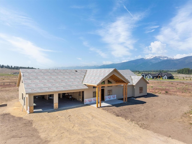 5130 Cameron Rose Ln, Stevensville, MT 59870 - view of front facade with dirt driveway and a mountain view
