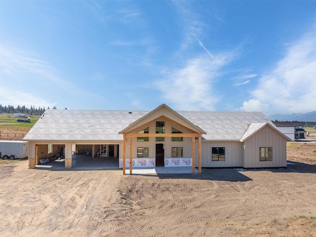 5130 Cameron Rose Ln, Stevensville, MT 59870 - property under construction featuring dirt driveway, board and batten siding, and a carport