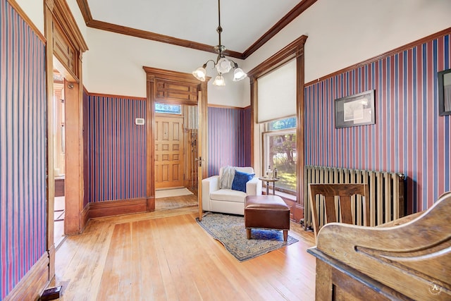 860 Hiawatha St, Helena, MT 59601 - sitting room with wood-type flooring, crown molding, and a chandelier