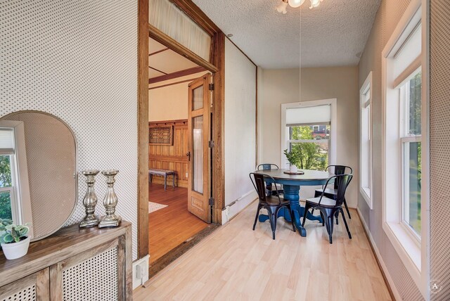 860 Hiawatha St, Helena, MT 59601 - living area featuring a chandelier, light wood-type flooring, crown molding, a fireplace with flush hearth, and a towering ceiling