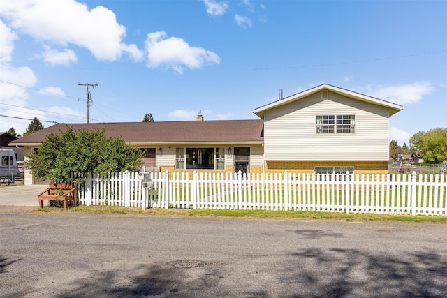3301 Albany Ave, Butte, MT 59701 - split level home with a fenced front yard and brick siding