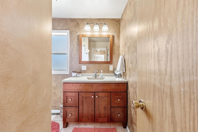 3301 Albany Ave, Butte, MT 59701 - bathroom featuring vanity, tile patterned floors, and a textured wall