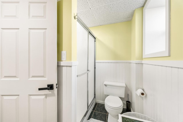3301 Albany Ave, Butte, MT 59701 - bathroom featuring wainscoting, a drop ceiling, and tile patterned floors