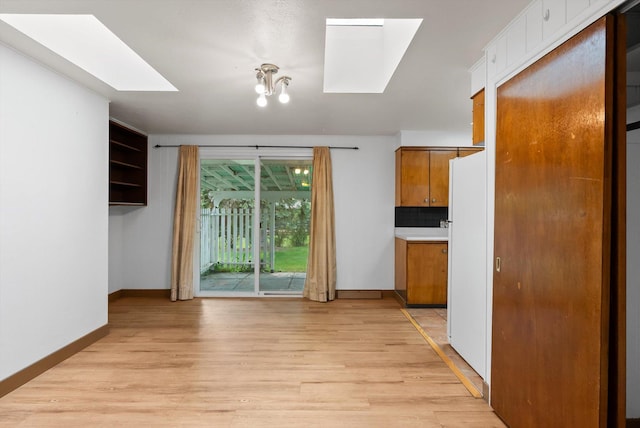 2611 Gilbert Ave, Missoula, MT 59802 - unfurnished dining area featuring a skylight and light wood-type flooring