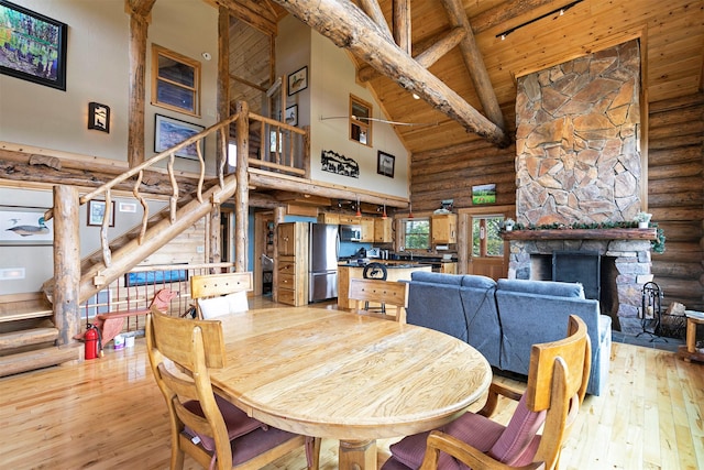 30 Douglas Lee Ln, Anaconda, MT 59711 - dining room with high vaulted ceiling, log walls, light wood finished floors, stairs, and a wooden ceiling with exposed beams