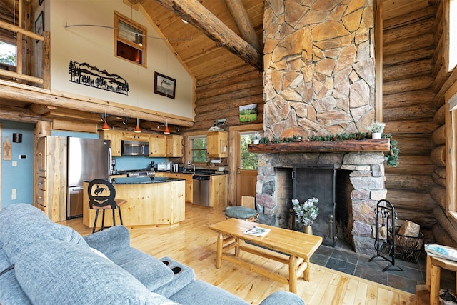 30 Douglas Lee Ln, Anaconda, MT 59711 - living room featuring rustic walls, high vaulted ceiling, a wooden ceiling with exposed beams, light wood-type flooring, and a fireplace