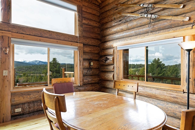 30 Douglas Lee Ln, Anaconda, MT 59711 - dining area with plenty of natural light, rustic walls, a mountain view, and wood finished floors