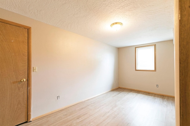 470 Strand Ave, Missoula, MT 59801 - spare room featuring light wood-style flooring and a textured ceiling