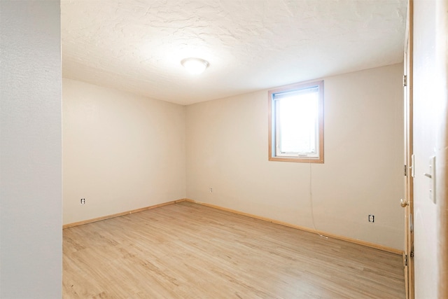 470 Strand Ave, Missoula, MT 59801 - unfurnished room featuring light wood finished floors and a textured ceiling