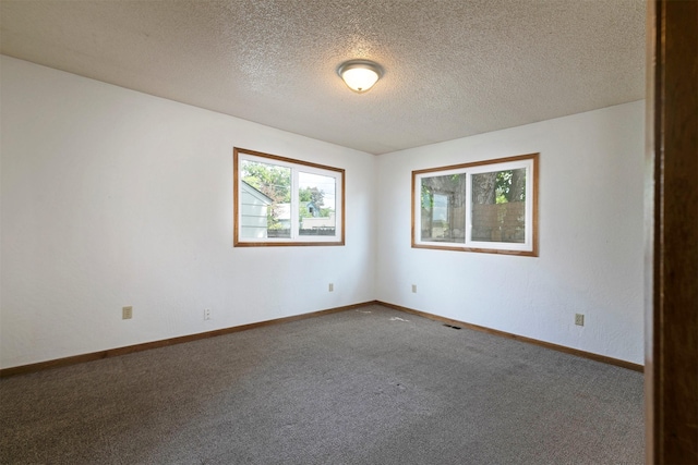 470 Strand Ave, Missoula, MT 59801 - spare room featuring carpet and a textured ceiling