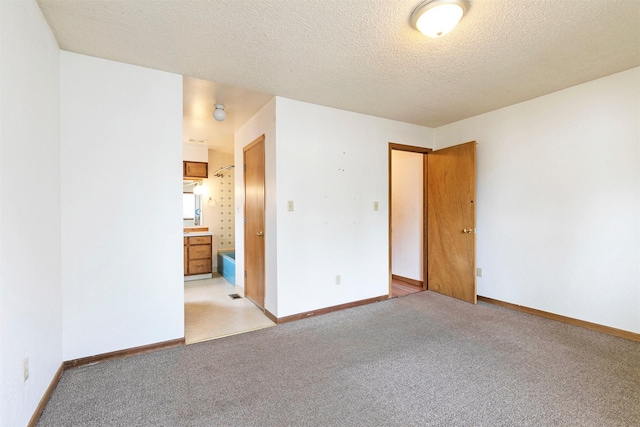 470 Strand Ave, Missoula, MT 59801 - unfurnished room featuring light colored carpet and a textured ceiling