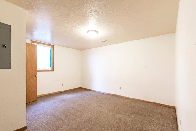 470 Strand Ave, Missoula, MT 59801 - spare room featuring electric panel, a textured ceiling, and carpet floors