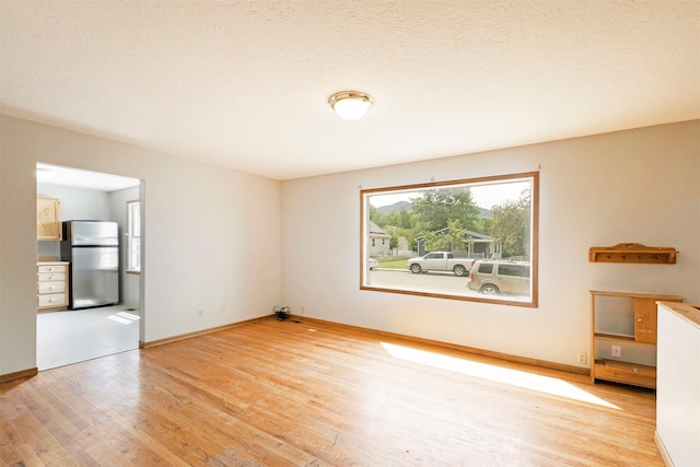 470 Strand Ave, Missoula, MT 59801 - unfurnished room with light wood-style flooring and baseboards