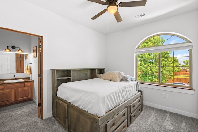 36 Silo St, Belgrade, MT 59714 - carpeted bedroom featuring ensuite bathroom and ceiling fan