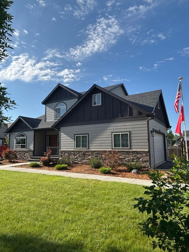 36 Silo St, Belgrade, MT 59714 - craftsman-style house featuring stone siding, board and batten siding, a garage, and a front lawn