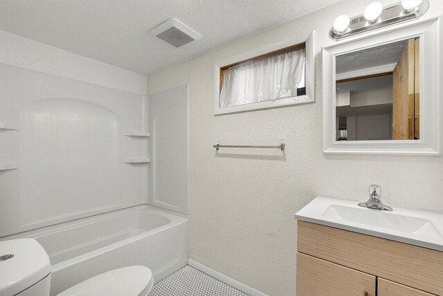1940 Dixon Ave, Missoula, MT 59801 - full bathroom with vanity, shower / tub combination, and a textured wall