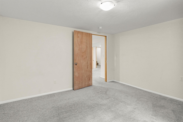 1940 Dixon Ave, Missoula, MT 59801 - carpeted empty room with a textured ceiling and baseboards
