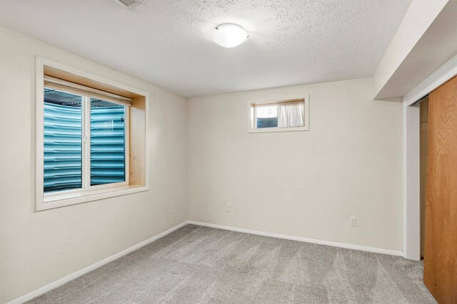 1940 Dixon Ave, Missoula, MT 59801 - unfurnished bedroom with carpet flooring and a textured ceiling