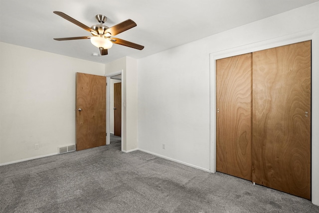 1940 Dixon Ave, Missoula, MT 59801 - unfurnished bedroom with carpet, a closet, and a ceiling fan