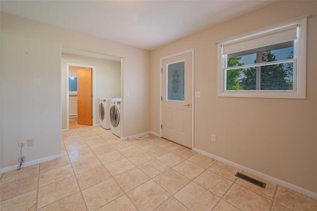 5706 Shannon Ct, Helena, MT 59602 - laundry room with washing machine and dryer and light tile patterned floors