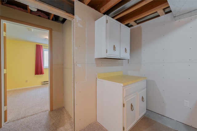 5706 Shannon Ct, Helena, MT 59602 - laundry room with a baseboard radiator and light colored carpet