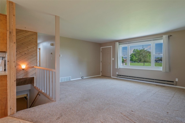 5706 Shannon Ct, Helena, MT 59602 - carpeted spare room featuring baseboard heating and wooden walls