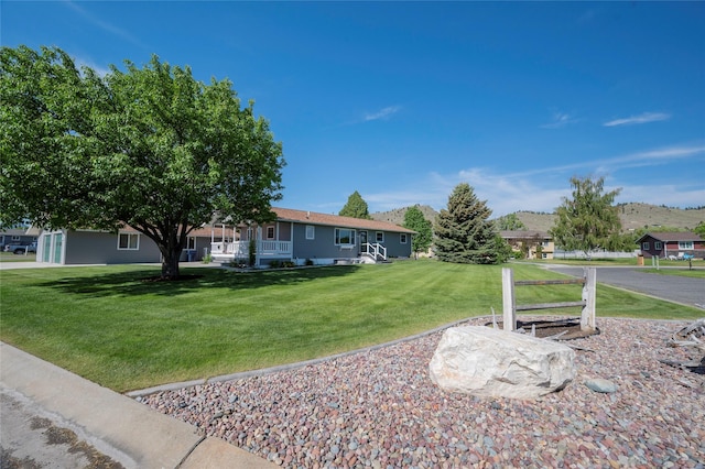 5706 Shannon Ct, Helena, MT 59602 - ranch-style home featuring a front lawn and a mountain view