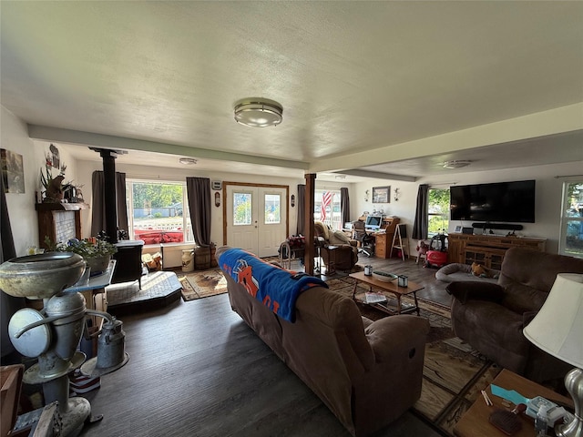 306 E Missoula Ave, Troy, MT 59935 - living room with ornate columns, wood finished floors, and plenty of natural light