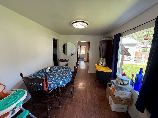 306 E Missoula Ave, Troy, MT 59935 - dining room featuring wood finished floors and baseboards
