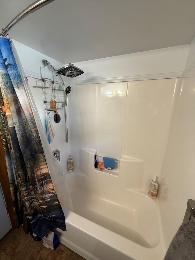 306 E Missoula Ave, Troy, MT 59935 - bathroom featuring shower / tub combo and wood finished floors