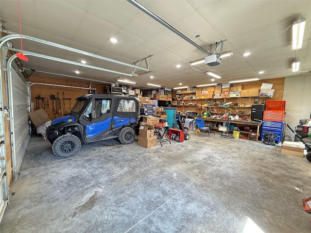306 E Missoula Ave, Troy, MT 59935 - garage with recessed lighting, a workshop area, and a garage door opener