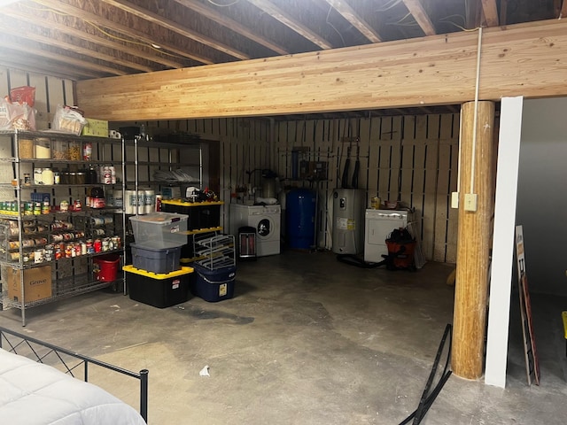 223 E G St, Sula, MT 59871 - garage featuring water heater and washer / clothes dryer