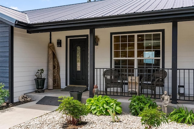 2813 Pine Lakes Ct, Stevensville, MT 59870 - doorway to property featuring a porch and a metal roof