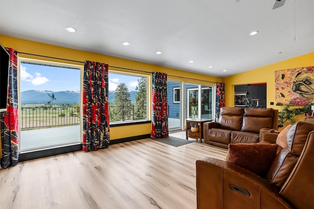 2813 Pine Lakes Ct, Stevensville, MT 59870 - living room with wood finished floors, recessed lighting, a mountain view, a ceiling fan, and vaulted ceiling