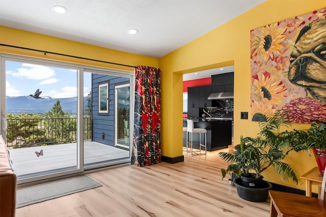 2813 Pine Lakes Ct, Stevensville, MT 59870 - doorway to outside featuring a mountain view, wood finished floors, and recessed lighting