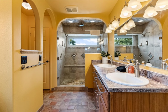 2813 Pine Lakes Ct, Stevensville, MT 59870 - bathroom with stone tile flooring, double vanity, and a shower stall
