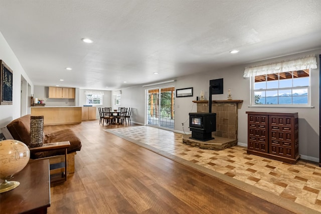 2813 Pine Lakes Ct, Stevensville, MT 59870 - living room featuring recessed lighting, light wood-style flooring, and a wood stove